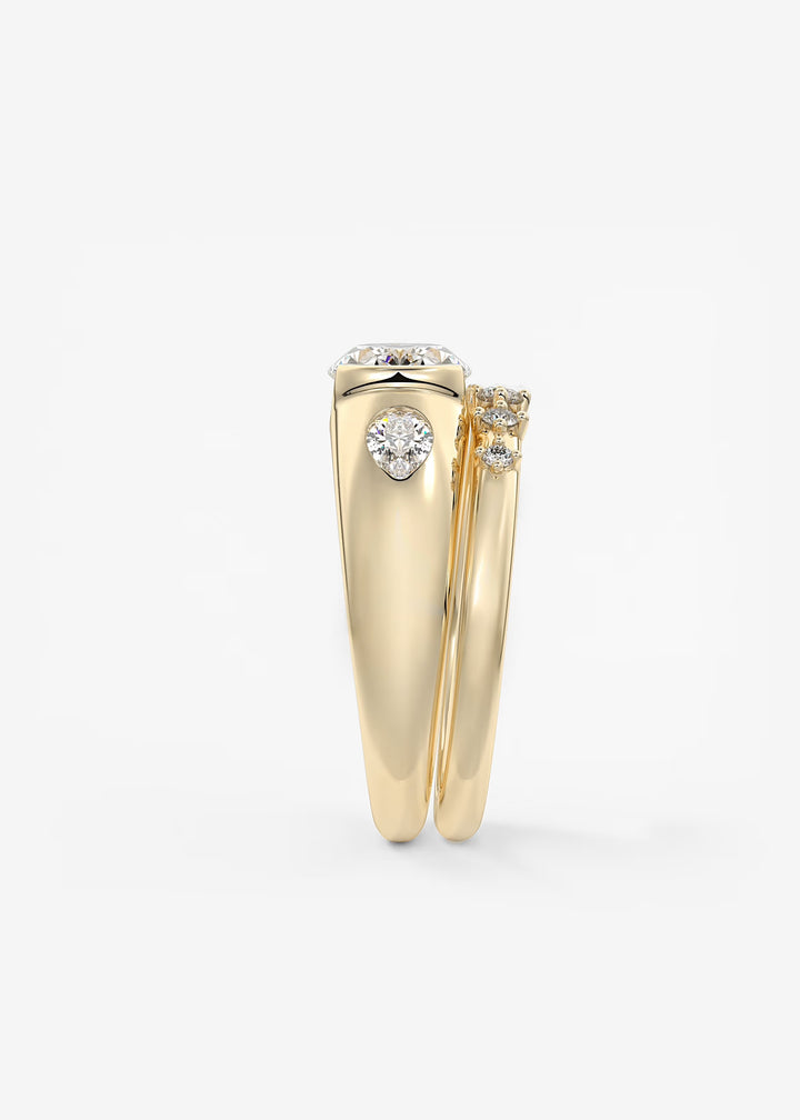 The Lune Trio Oval Cut Half Bezel Three Stone Engagement Ring with Peekaboo Gallery and Tapered Baguettes#material_gold