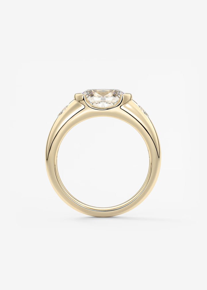 The Lune Trio Oval Cut Half Bezel Three Stone Engagement Ring with Peekaboo Gallery and Tapered Baguettes#material_gold