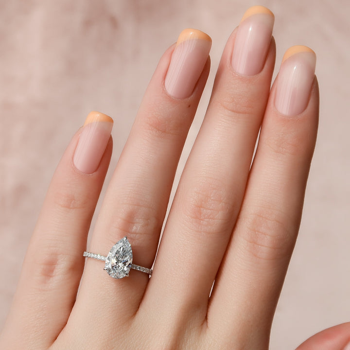 The Pave April Pear Lab Diamond Moissanite Engagement Ring *Shown with 2 ct #material_white