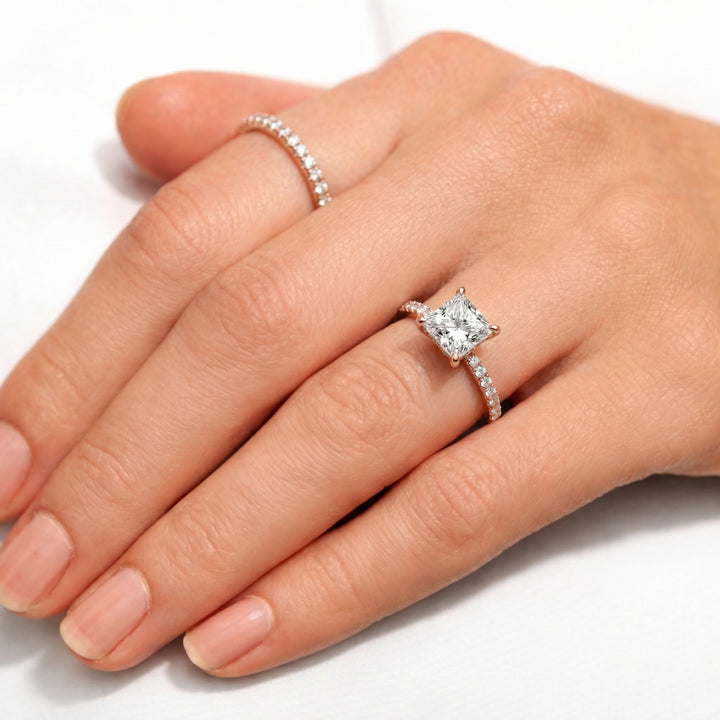 Diamond ring on a hand with a white background #material_rose