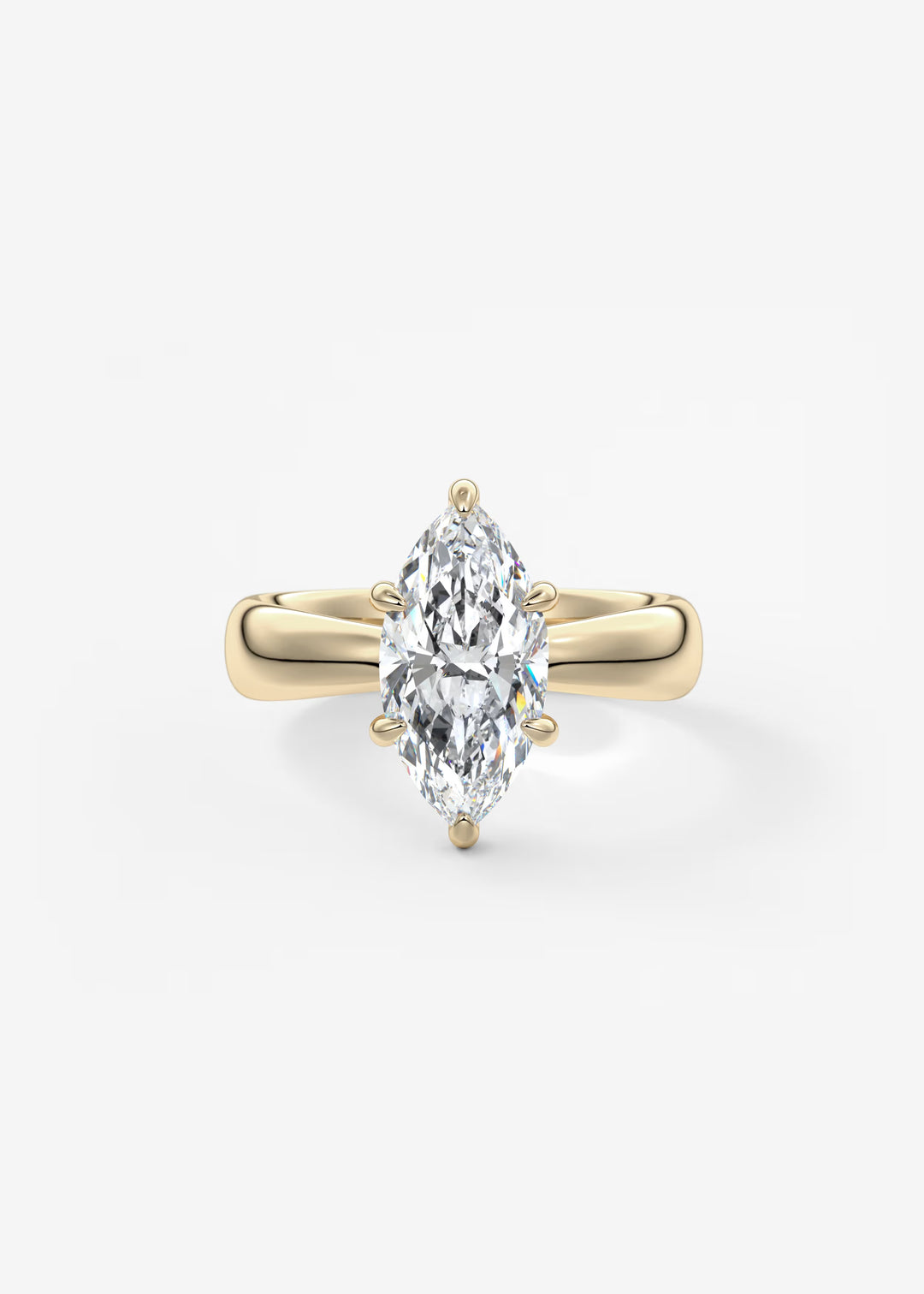 A yellow gold ring featuring a large marquise-cut diamond in a four-prong setting, centered on a clean white background.#material_gold