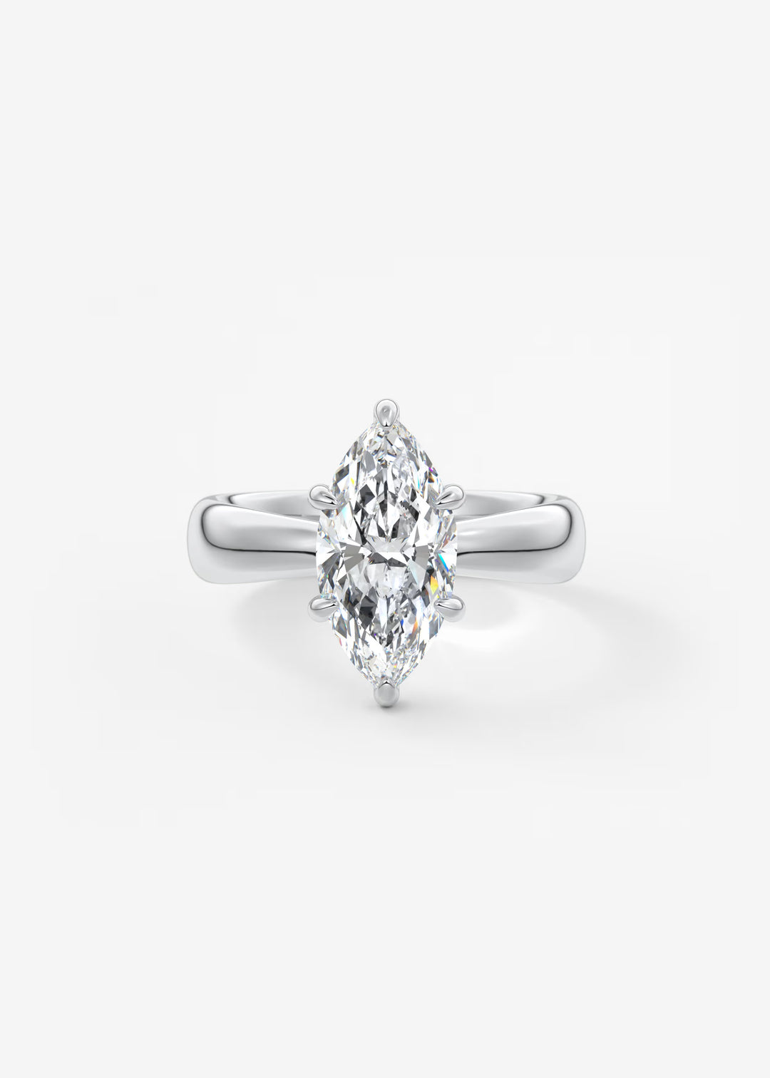 A silver-tone ring featuring a marquise-cut diamond center stone in a prong setting, shown on a clean white background.#material_white