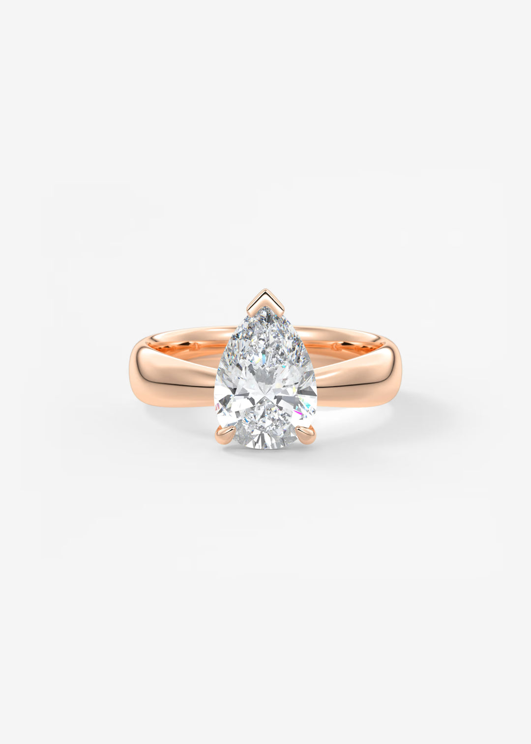 A pear-cut diamond engagement ring set in a rose gold band, centered on a clean white background.#material_rose