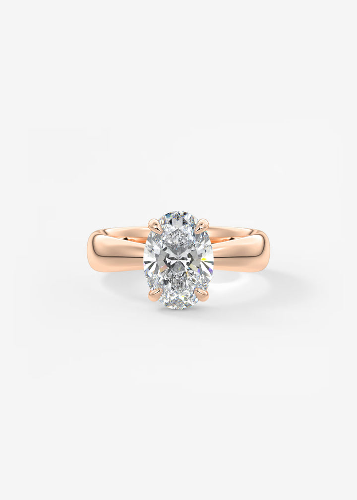 A rose gold solitaire engagement ring featuring a large oval-cut diamond, set against a clean white background.#material_rose