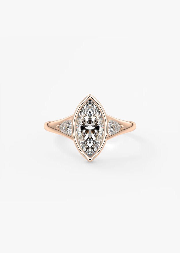 A rose gold ring featuring a marquise-cut diamond center stone with smaller diamonds set along the shoulders, shown on a clean white background.#material_rose