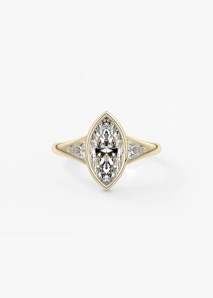 A yellow gold ring featuring a marquise-cut diamond center stone with smaller diamonds set along the shoulders, shown on a clean white background.#material_gold