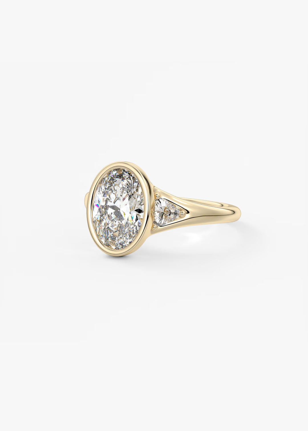 The Solene Bezel Set Oval & Trillion Split Shank Engagement Ring#material_gold