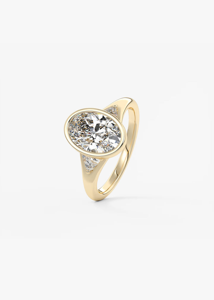 The Solene Bezel Set Oval & Trillion Split Shank Engagement Ring#material_gold