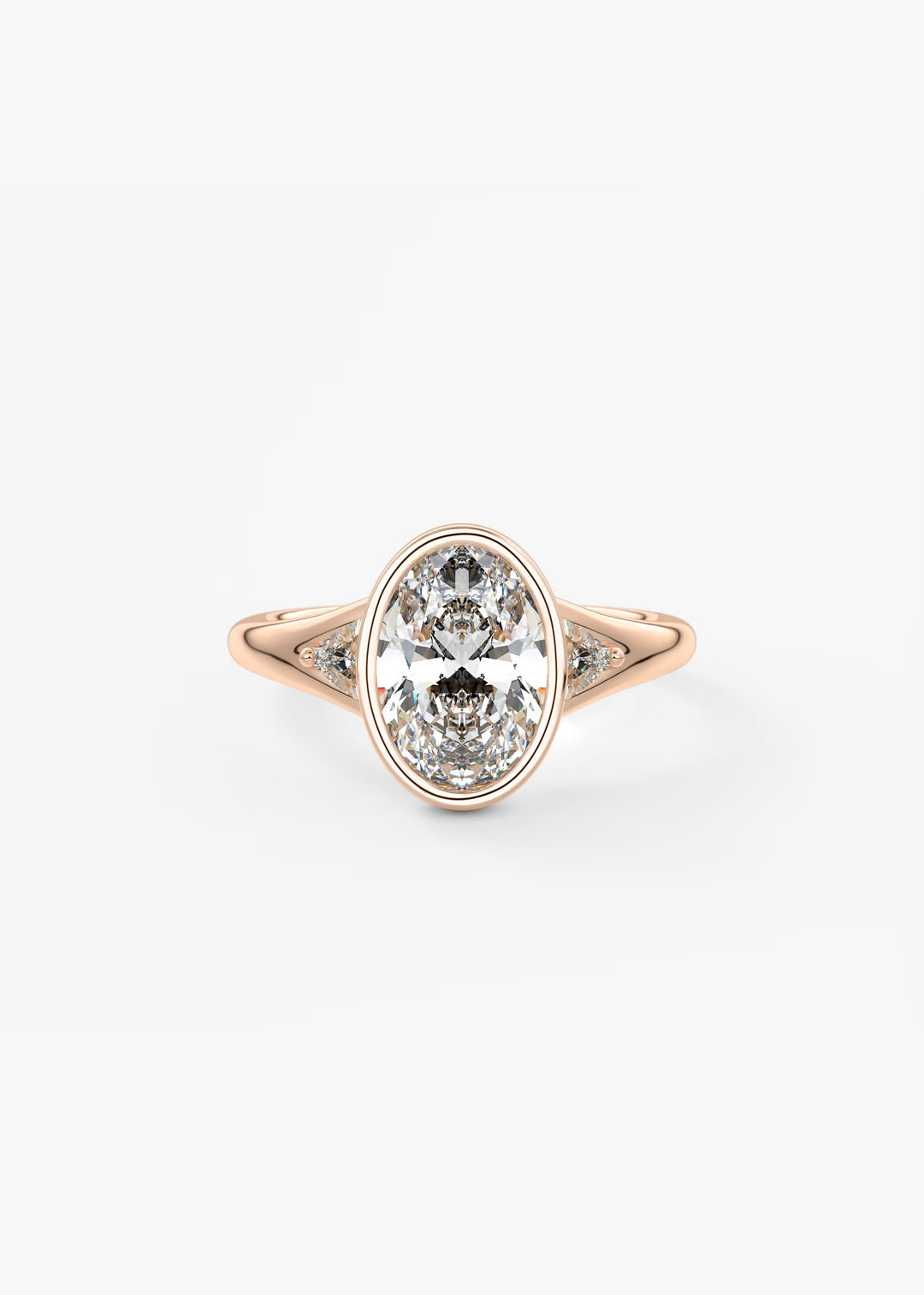 An oval-cut diamond ring in a rose gold setting with small accent diamonds on either side of the band, shown against a plain white background.#material_rose