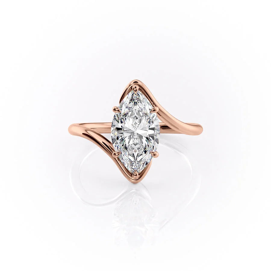 Rose gold ring with a marquise-shaped diamond on a white background #material_rose