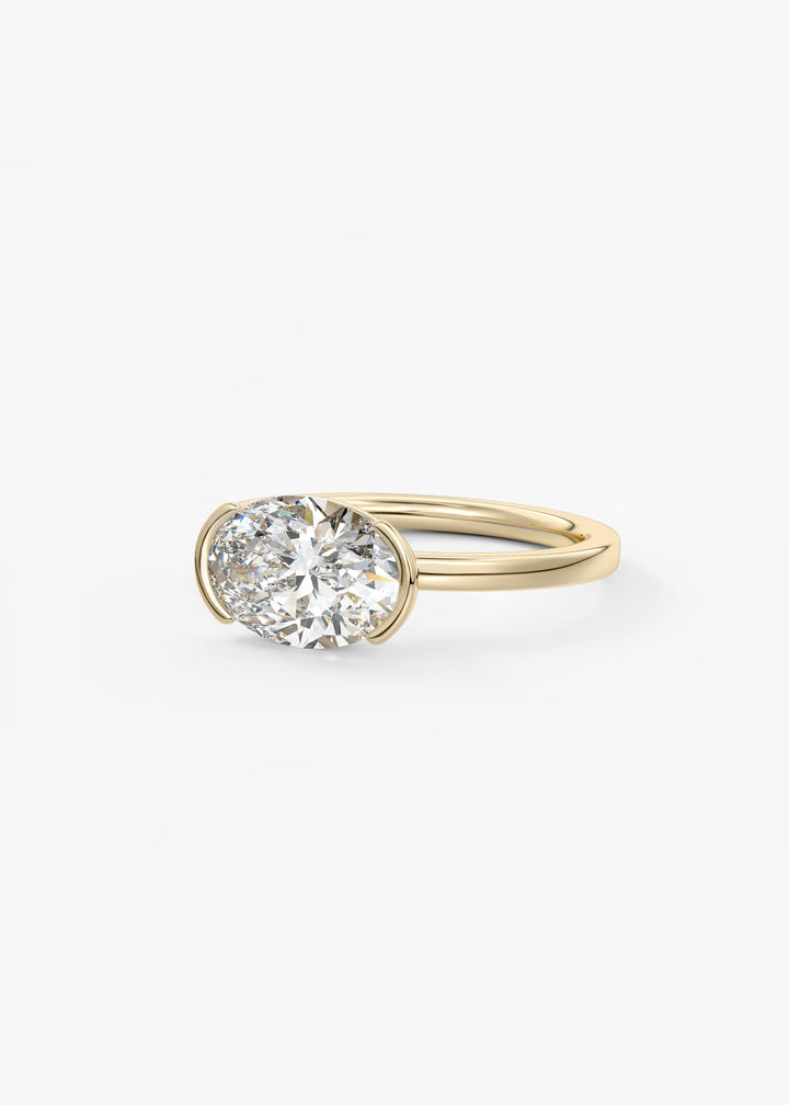 The Vela Horizon East West Oval Cut Engagement Ring with Half Bezel#material_gold