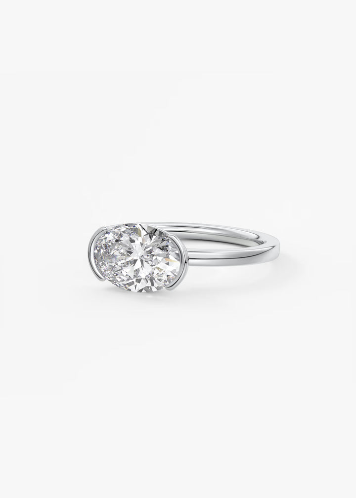 The Vela Horizon East West Oval Cut Engagement Ring with Half Bezel#material_white
