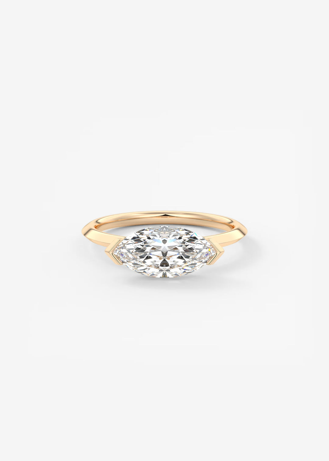 A yellow gold ring featuring a marquise-cut clear gemstone in a prong setting, centered on a clean white background.#material_rose