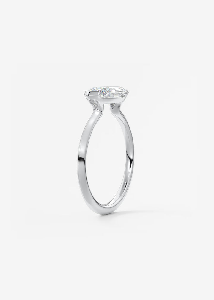 The Vela East West Marquise Cut Engagement Ring with Half Bezel#material_white