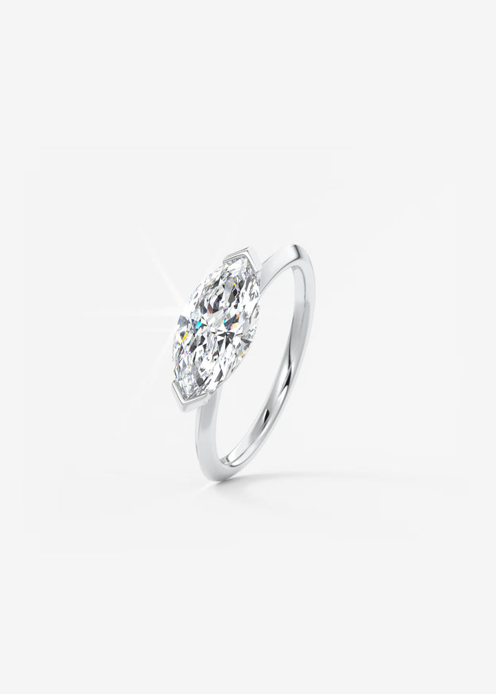 The Vela East West Marquise Cut Engagement Ring with Half Bezel#material_white