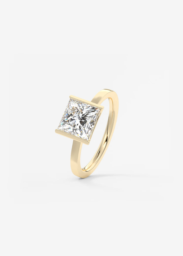 The Vela Princess Cut Engagement Ring with Half Bezel#material_gold