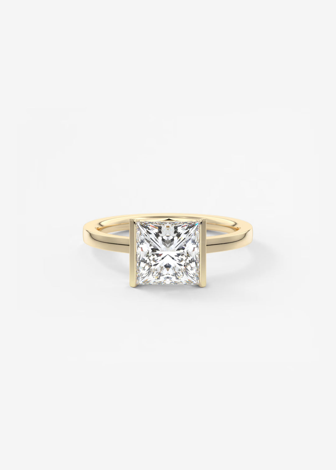 A classic princess-cut diamond engagement ring in a yellow gold band, photographed on a clean, light gray background.#material_gold