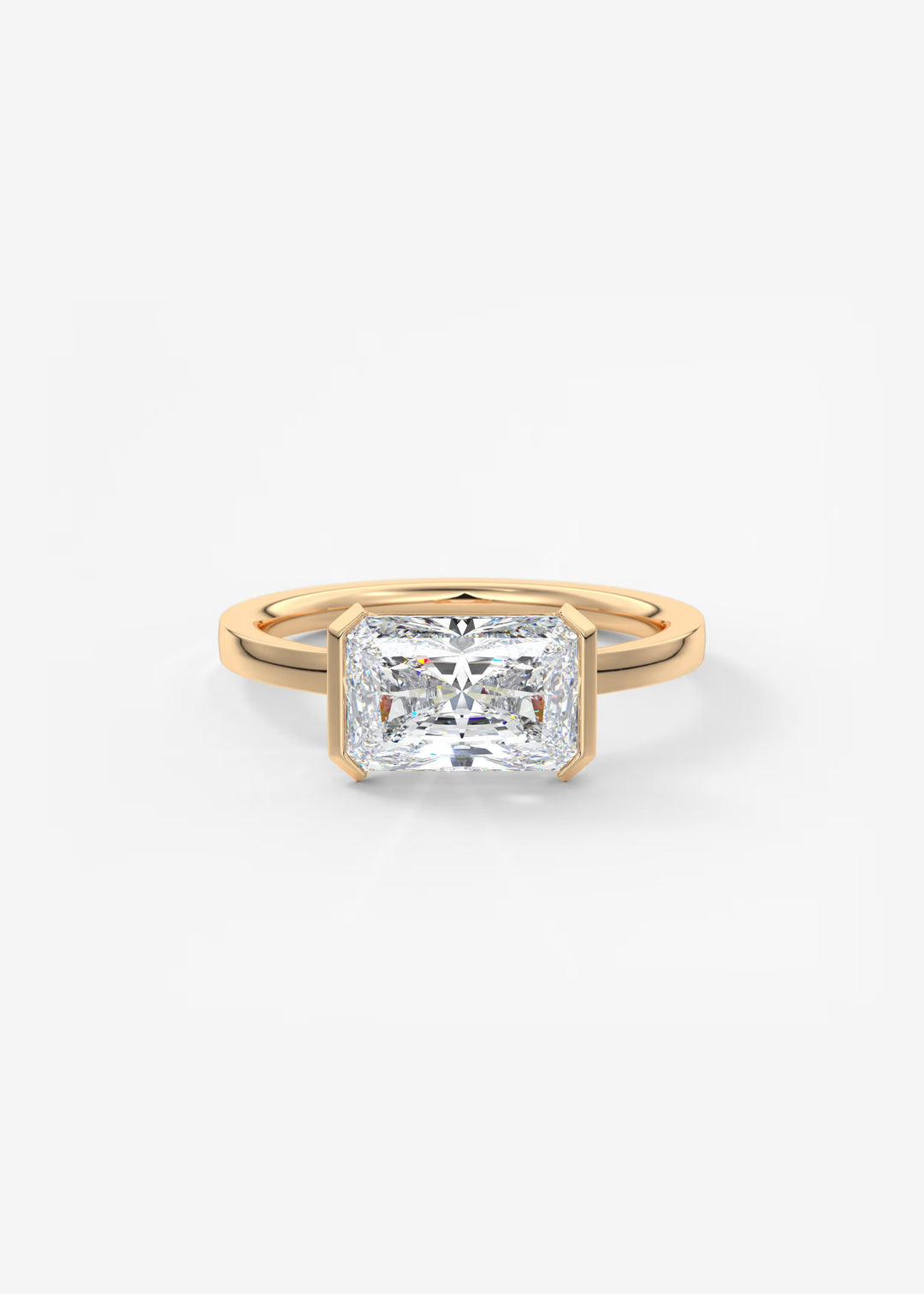 A yellow gold ring featuring a large, square-cut clear gemstone in a prong setting, shown on a clean white background.#material_rose