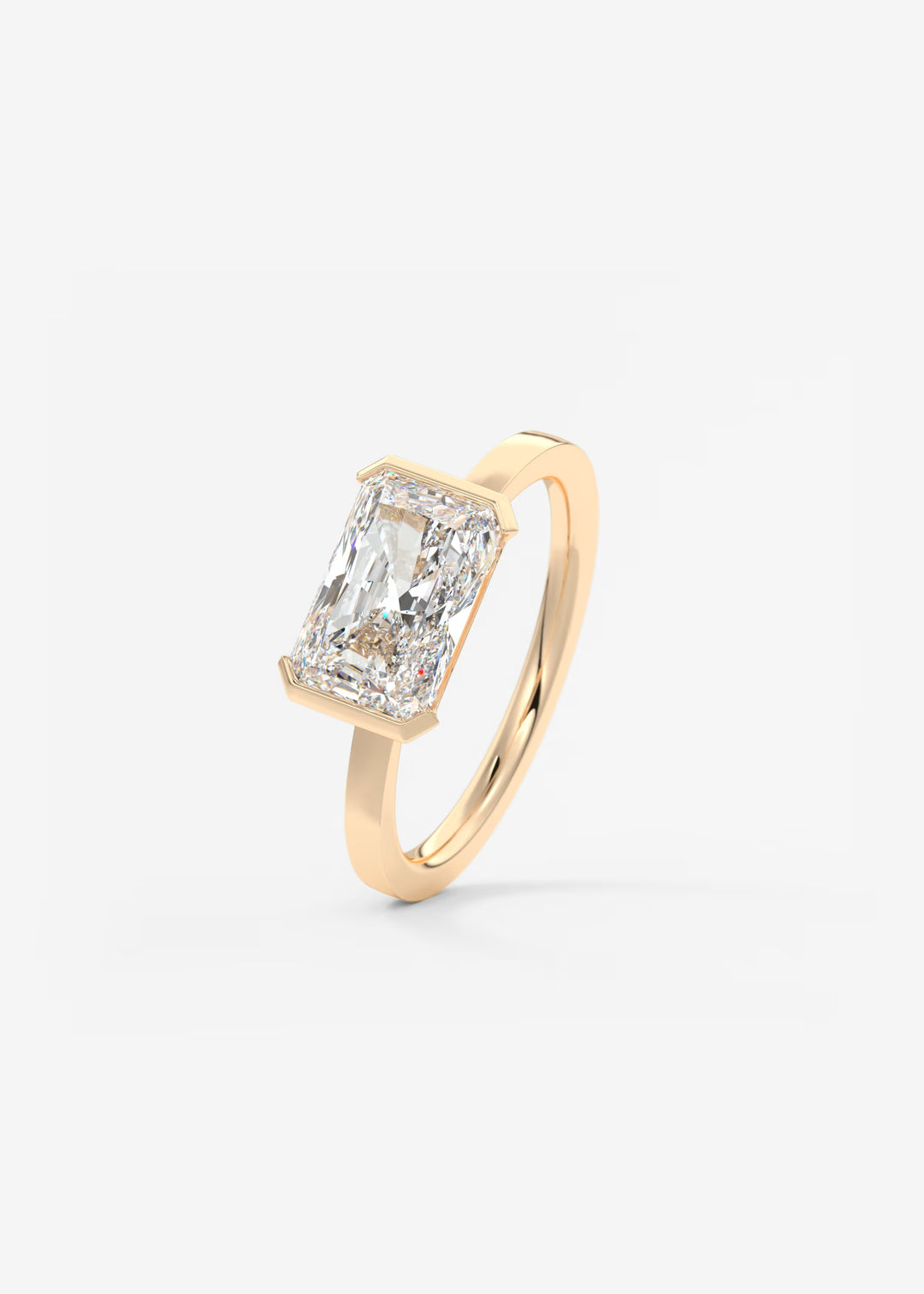 The Vela East West Radiant Cut Engagement Ring with Half Bezel#material_rose
