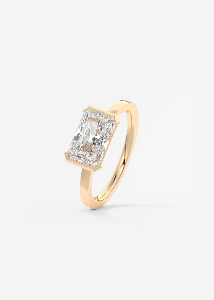 The Vela East West Radiant Cut Engagement Ring with Half Bezel#material_rose