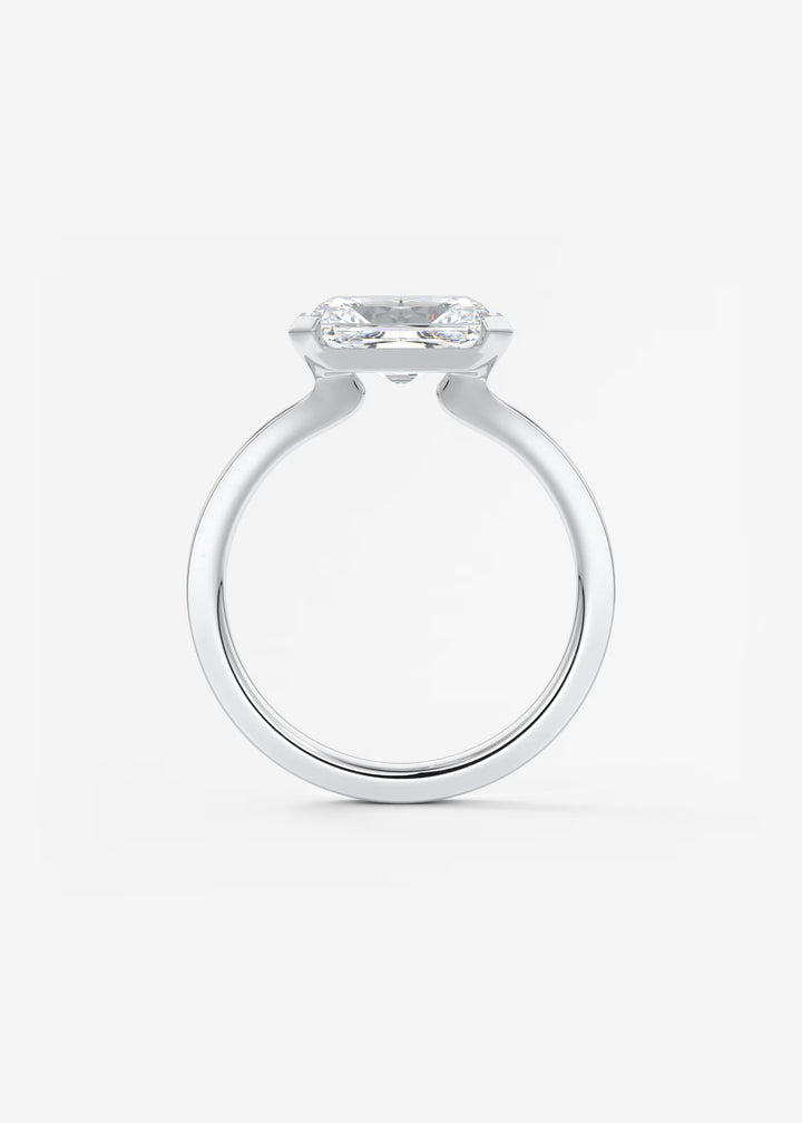 The Vela East West Radiant Cut Engagement Ring with Half Bezel#material_white