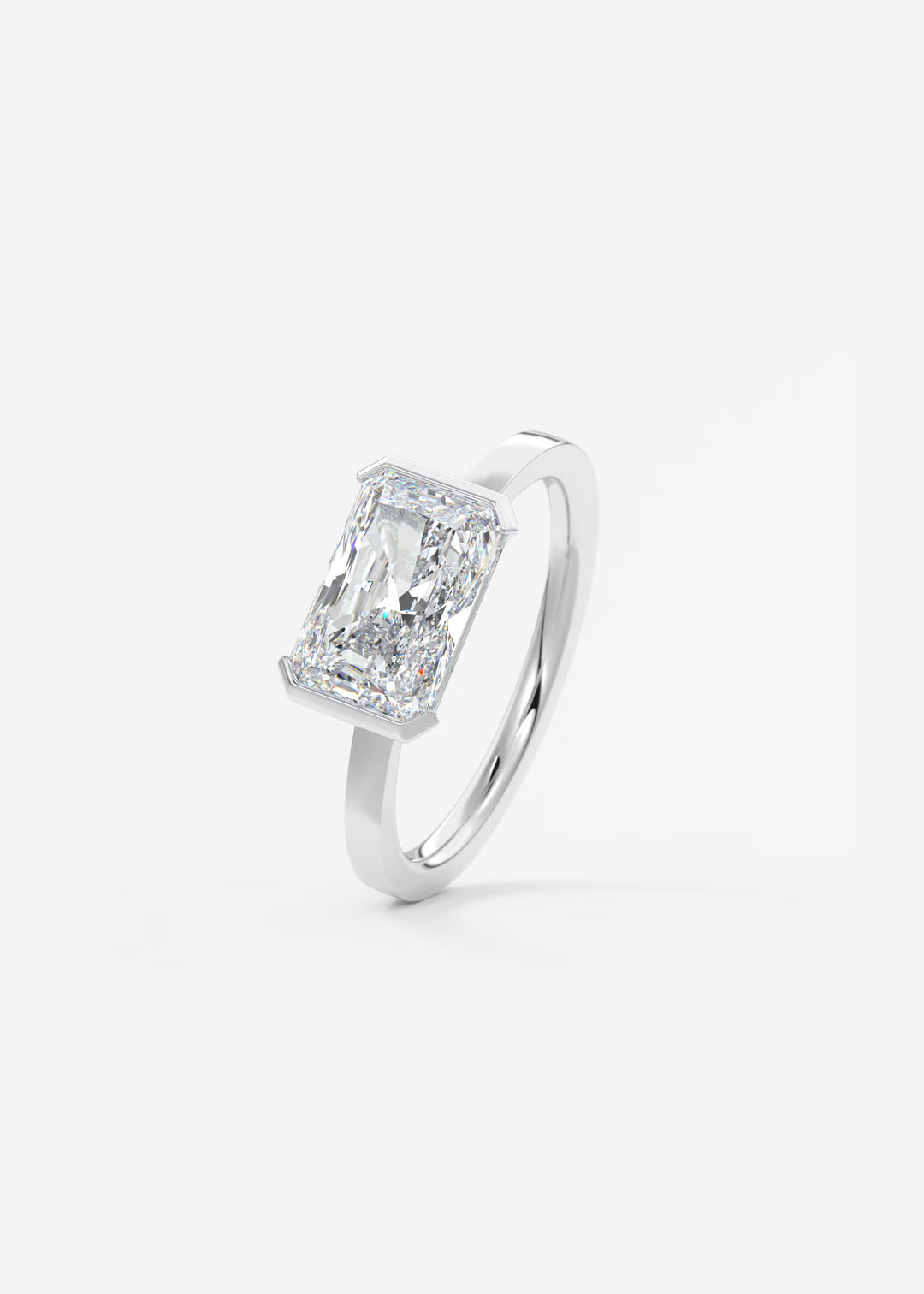 The Vela East West Radiant Cut Engagement Ring with Half Bezel#material_white