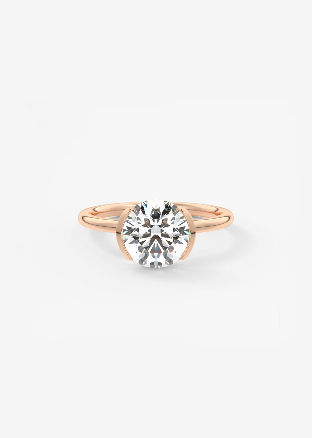A rose gold solitaire engagement ring featuring a round brilliant-cut diamond center stone, set against a clean white background.#material_rose