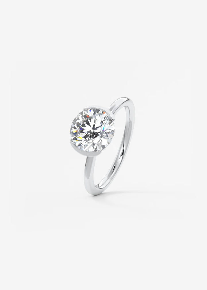 The Vela Round Half Bezel Engagement Ring#material_white