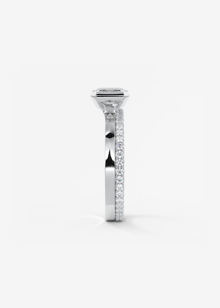 The Vela East West Emerald Cut Engagement Ring with Half Bezel#material_white