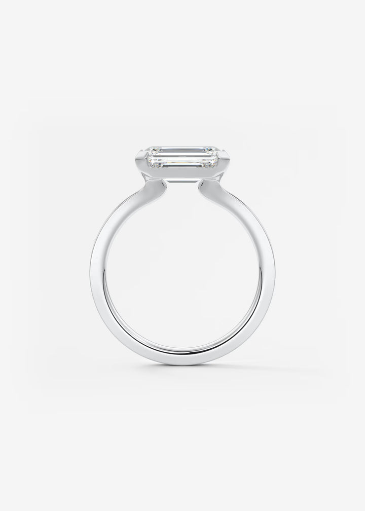 The Vela East West Emerald Cut Engagement Ring with Half Bezel#material_white