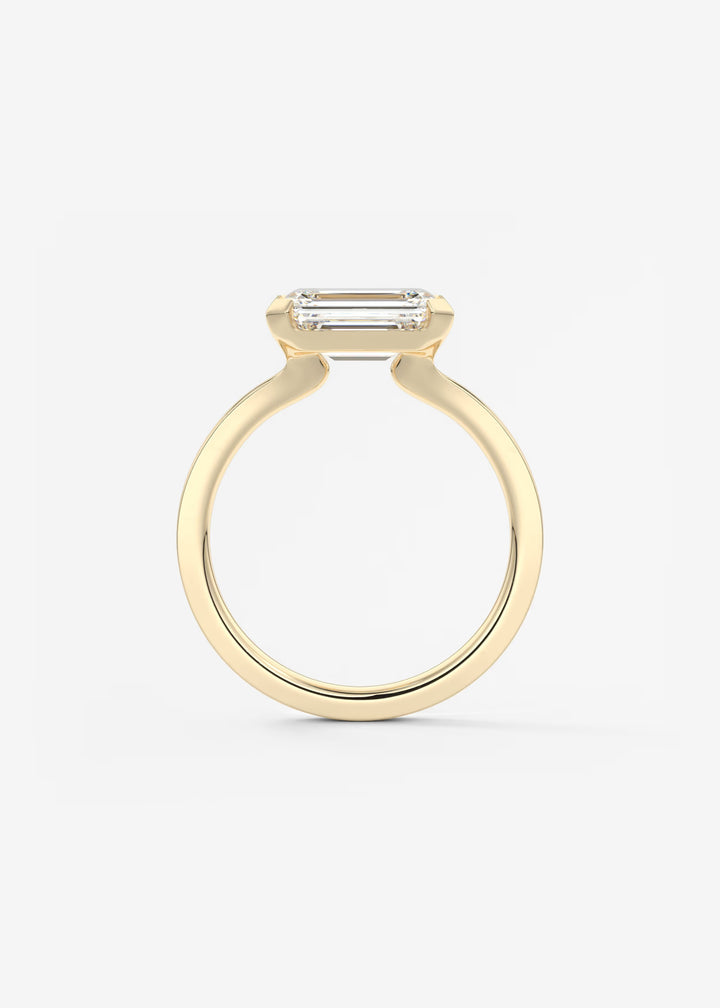 The Vela East West Emerald Cut Engagement Ring with Half Bezel#material_gold